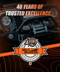 Front view of a Jeep with winch and Mile Marker 40th anniversary logo, highlighting 40 years of trusted excellence in off-road products.