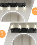 Three Light Matte Black Vanity Light Fixtures For Over Mirror In Bathroom with clear glass shades, shown lit above mirror.