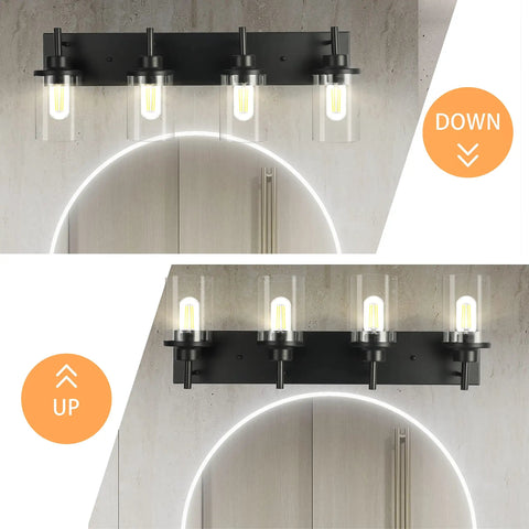 Three Light Matte Black Vanity Light Fixtures For Over Mirror In Bathroom with clear glass shades, shown lit above mirror.