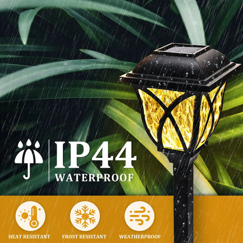 Close-up of a waterproof LED garden light in rain, from Six Pack Solar Outdoor Lights Waterproof LED Garden Decor for Yard.