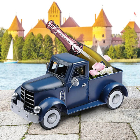 Farmhouse Blue Truck Tabletop Decor with champagne and flowers on a patio