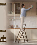 3 Step Folding Aluminum Ladder For Home Use 450 Pound Capacity Lightweight Yet Ridiculously Sturdy Open And Store With Ease Perfect For Indoor Or Outdoor Jobs Sturdy Metal Frame With Non Slip Feet, woman cleaning kitchen cabinet