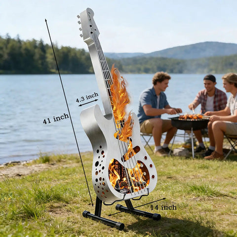 Guitar-shaped stainless steel wood burning fire pit with stand by a lake, efficient burn design, perfect for cozy evenings.