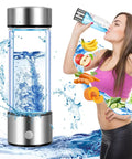 Glass bottle with stainless accents of Hydrogen Water Bottle Generator 2 Pack With SPE PEM Tech Water Ionizer next to woman drinking