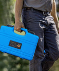 Person carrying blue case of Engine Camshaft Alignment Timing Tool Kit For BMW Mini Cooper N12 N14 Engines Plus Citroen Peugeot