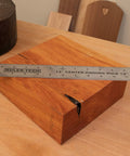 Stainless Steel Center Finder Ruler With No Guesswork And Dual Scale, 12 inch, on a wooden block for precise center marking