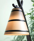 Detail of Wright 1 Light Table Lamp in Oil Rubbed Bronze Finish with amber shade in home office setting