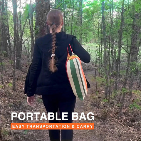 Person carrying Portable Hammock With Carrying Bag And Two Tree Straps For Camping Travel And Beach Outdoor Fun in forest