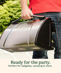 Person carrying Portable Stainless Steel Gas Grill With Locking Lid For Easy Transport 8000 BTU Propane Grill