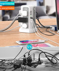 Surge Protector Power Strip Tower with PD18W USB C Port, 10 ft cord, 12 AC outlets, charging multiple devices in home office.