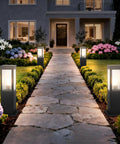 Heavy Duty Outdoor Path Light 15.75 Inches Modern Landscape Bollard with warm glow illuminating garden walkway at night.