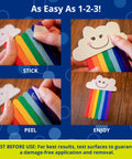 Using Double-Sided Craft Dots Half Inch Permanent Adhesive Points to attach rainbow craft sticks with a smiling cloud for DIY projects.