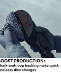 Person attaching Xtract Net Disc 710W 6 Inch Hook And Loop Sanding Disc to sander showcasing quick disc change feature.