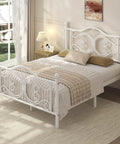 Full Size Metal Bed Frame Featuring Sculpted Butterfly Pattern Headboard In Shimmering White Polished Finish with pillows and blanket.