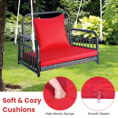 Red Wicker Porch Swing Chair For One With Cushioned Seat And Back, reinforced metal frame, shown in garden setting.