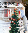 Person using Five Step Aluminum Ladder With Tool Tray, Anti Slip Folding Stool For Adults against outdoor Christmas tree.