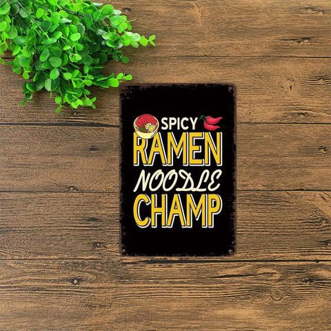 Ramen Obsessed Vintage Metal Tin Sign Wall Art 8x12 Inch for kitchen decor with text 'Spicy Ramen Noodle Champ' on wood background.