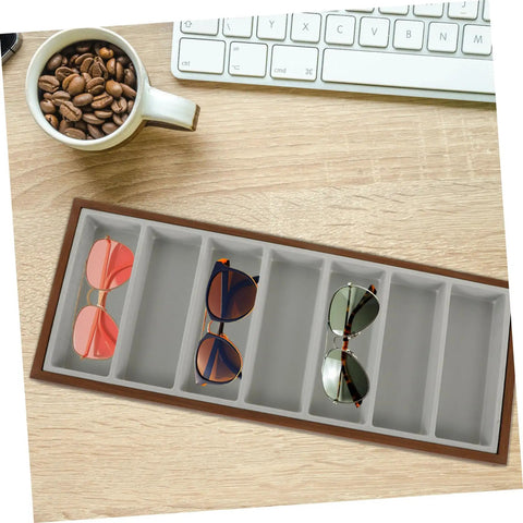 Keep Your Gear Sorted With This Hella Practical 3 Piece Wooden Sunglasses Display Stand Featuring Seven Grid Compartments And Soft Cloth Lining For Shades Jewelry And Watches, showing sunglasses organized in a light brown wooden tray.