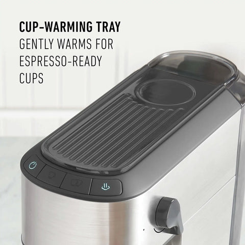 Compact Stainless Steel Espresso Maker With Built In Milk Frother Shoots Pro Level Lattes And Cappuccinos Daily Ultra Sleek countertop coffee brewer with cup-warming tray on top.