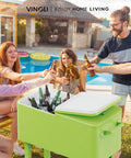 80 Quart Rolling Ice Chest Cooler Cart For Patio Parties And Party Ready Backyard Bar Setup With Folding Shelf And Bottle Opener Light Green Portable Beverage Cooler On Wheels with people enjoying drinks by a poolside.