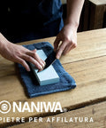 Pro Grade Ceramic Whetstone 5000 Grit With Base for Knives and Blades in use on wooden table
