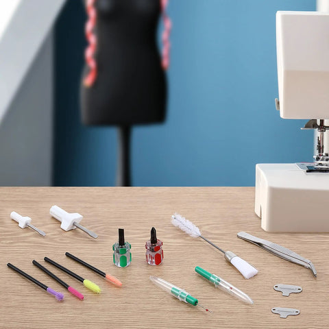 Complete 14 Piece Sewing Machine Cleaning Kit With Tweezers Double Headed Brush Must Have Screwdrivers Seam Rippers And Silicone Brushes on table