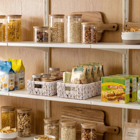 Water Hyacinth Wicker Storage Baskets For Organizing On Shelves And In Pantry White Two Pack Perfect For Towels Snacks Laundry Supplies Bins Eleven And A Quarter By Seven And A Half By Three And A Half Inches on pantry shelf with assorted snacks and jars