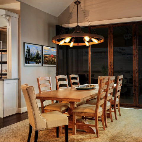 31.5 Inch Farmhouse Chandelier With Rustic Wagon Wheel Silhouette in Vintage Rust and Black Finish over dining table