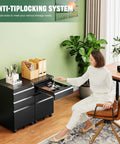 Woman using 3 Drawer Mobile File Cabinet With Lock Heavy Duty Under Desk Steel Filing Cabinet For Home Office Organizer Fits Letter Legal A4 Fully Assembled 5 Wheels 360 Degree Swivel Black in office setting.