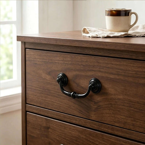 Four Pack Antique Drawer Pulls In Black Finish on wood dresser