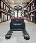 MechMaxx 3300lb Lithium Electric Pallet Jack with 45x27 forks in warehouse aisle for smooth cargo handling.