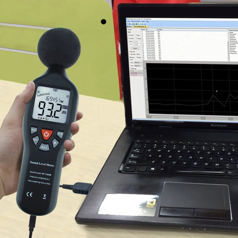 Hand using Go-To Portable Decibel Meter With Data Logger, 30 To 130 dB Range, Pro-Grade Sound Level Meter connected to laptop