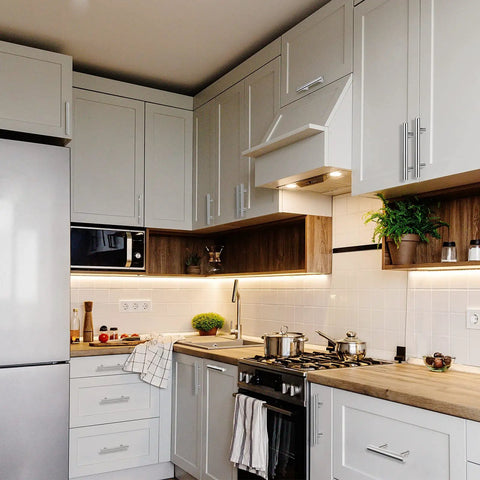 Modern kitchen with 100 Pieces Brushed Stainless Steel Cabinet Pulls 3 Inch Hole Center Handles on white cabinets.