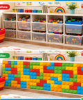 Six Foot Building Block Table Skirt With Bold Primary Bricks For Teacher Desk And Classroom Tables covering storage bins in classroom.