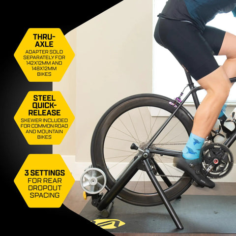 Cyclist using Fluid2 Indoor Bike Trainer For Road And Mountain Bikes With Realistic Road Feel And Progressive Fluid Resistance
