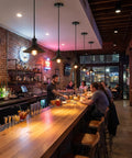 Interior of a bar featuring Harwez Matte Black Industrial Vintage Mini Pendant Light Kit E26 LP-0661 above the counter.