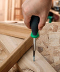 Using 6 In 1 Multi Bit Screwdriver And Nut Driver Tool With Cushioned Grip for DIY home projects on wooden framework.