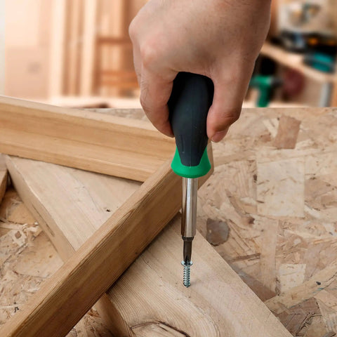 Using 6 In 1 Multi Bit Screwdriver And Nut Driver Tool With Cushioned Grip for DIY home projects on wooden framework.