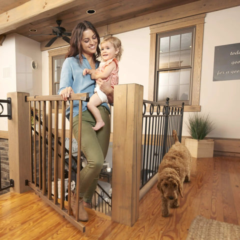 Woman and child using Walk-Thru Top Of Stairs Baby Gate Farmhouse Collection Expands From 30 To 48 Inch Openings, 32 Inch Tall