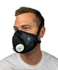 Side view of a man wearing the All Day Reusable Air Filtration Mask With 99.8 Percent Filtration Efficiency, Anti Fogging, Three Strap Design.