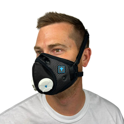 Side view of a man wearing the All Day Reusable Air Filtration Mask With 99.8 Percent Filtration Efficiency, Anti Fogging, Three Strap Design.