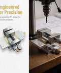 Rock Solid Precision Cross Slide Table With Heavy Duty Vice on a workbench, showcasing aluminum alloy structure and fine adjustment knobs.