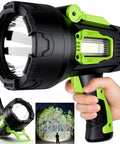 Rechargeable Spotlight 2,000,000 Lumen Handheld Searchlight With Foldable Tripod, person illuminating trees at night.
