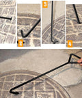 Two Piece 80 Centimeters Manhole Hook Lifter Set in use lifting a heavy manhole cover, showing close-up of steel lifting hooks.
