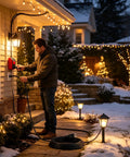 Man using 10 Foot Heavy Duty 3 Prong Extension Cord With Built In Toggle Switch And 14 Awg Copper Wire Rated 15 Amps outdoors.