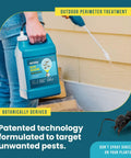 Person using Bug Doom Insect Barrier Spray For Home And Yard, 1 gallon bottle with wand sprayer near house foundation.