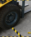 Forklift wheel on Built Like A Rock 5S Floor Marking Tape Yellow 6 Inch Wide 100 Foot Roll Heavy Duty Industrial Beveled Edge.
