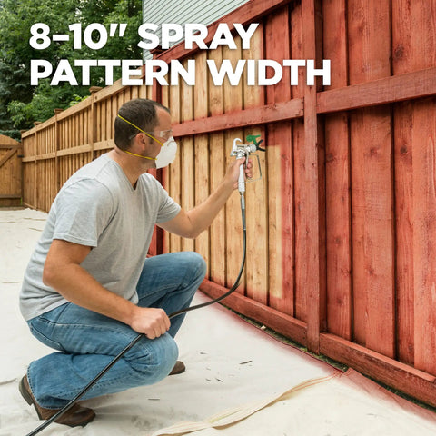 Person using High Efficiency Airless 413 Reversible Spray Tip For Sealers And Stains on fence, 8-10 inch spray pattern visible