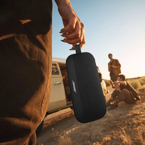 Person holding SoundLink Flex Bluetooth Speaker Second Gen Portable Outdoor Party Buddy With Hi Fi Audio Waterproof And Dustproof USB C