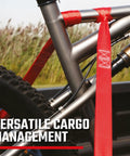 Straight Shooter 10 Piece Ratchet Strap Kit With Soft Loops And Stretchy Bungee Cords Heavy Duty Cargo Securing Set With Storage Bag Comfort Handle Smooth Use For Weekend Warriors Truck securing a bicycle frame in a truck bed.
